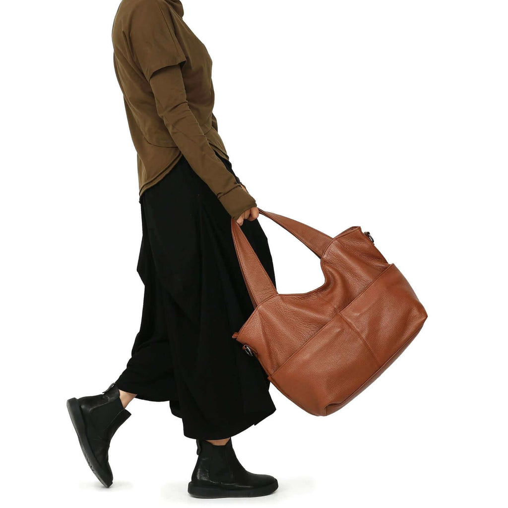 Leather handbag carried by hand for a classic look