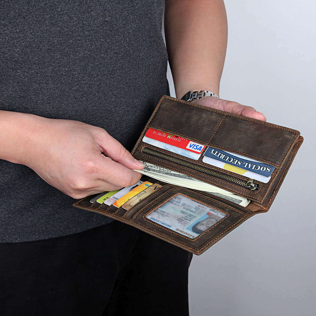 Card storage compartments inside vintage leather wallet.