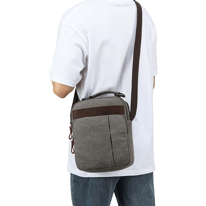 Crossbody bag worn on shoulder by model