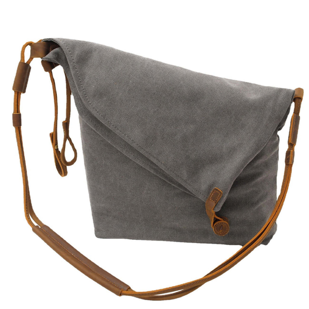 Crossbody styling of grey canvas bag