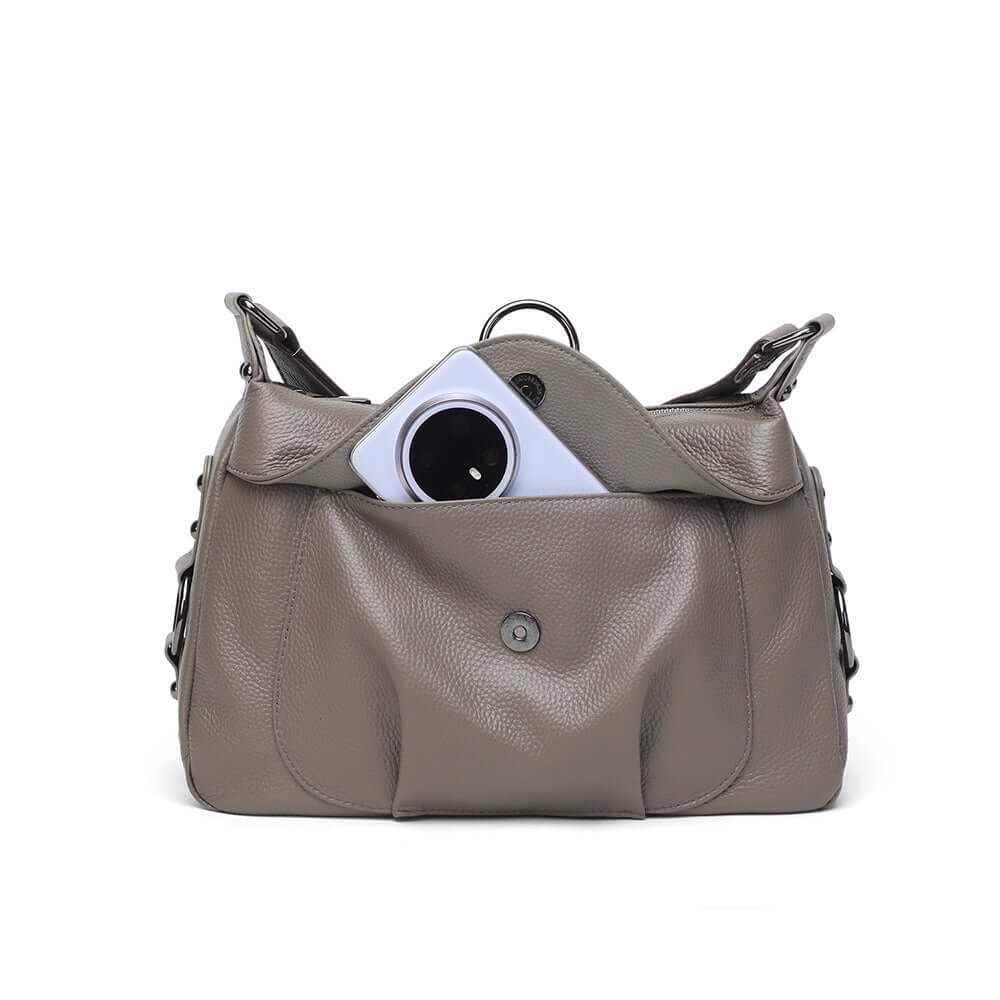 Showing the front compartment of the leather crossbody bag