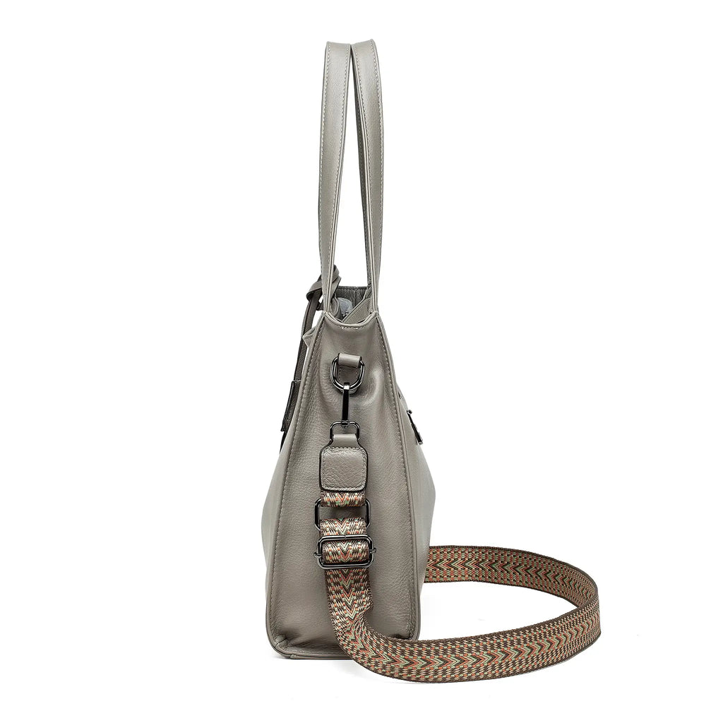 Side angle showing silhouette of grey leather handbag