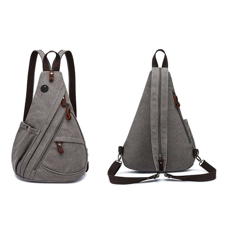 Unisex grey canvas sling bag worn as backpack style