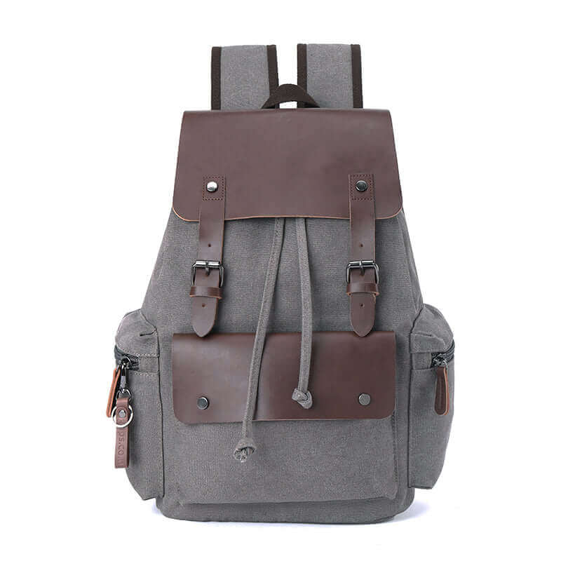 Grey vintage canvas backpack with leather accents, suitable for both casual and professional settings.