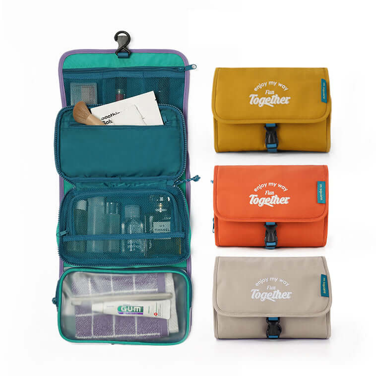 Folded hanging travel toiletry bag with buckle closure