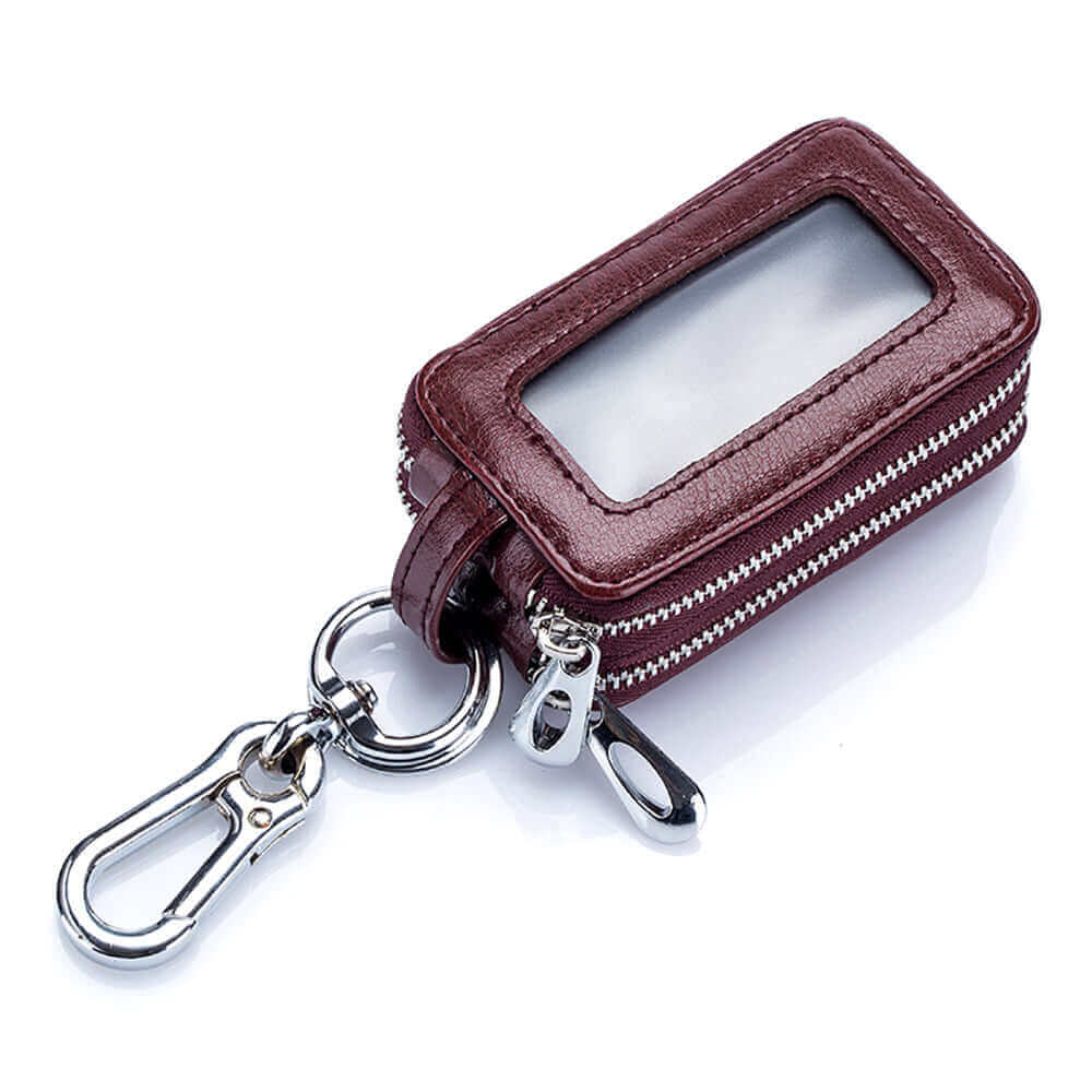 Leather car key case holding a remote car key.