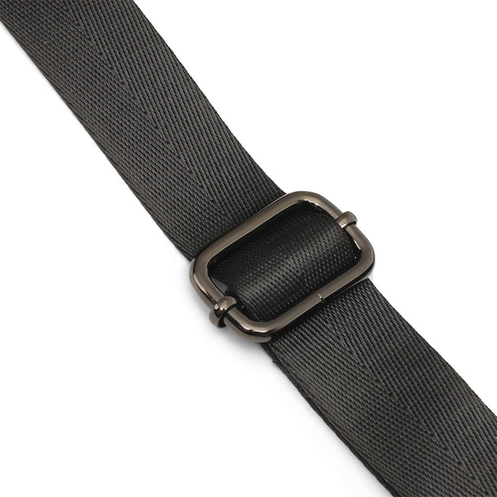 Adjustable strap detail on black leather backpack