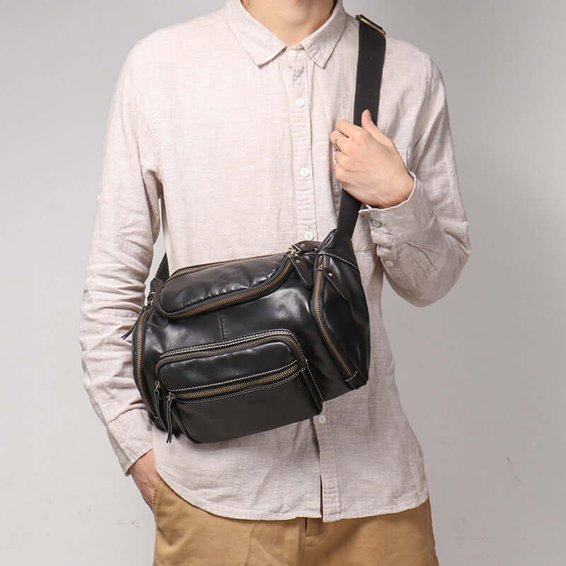 men wearing leather crossbody bag across shoulder