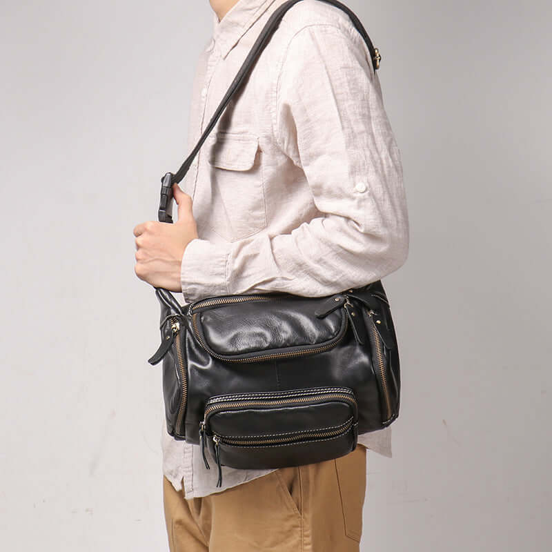 leather bag worn as shoulder bag for men