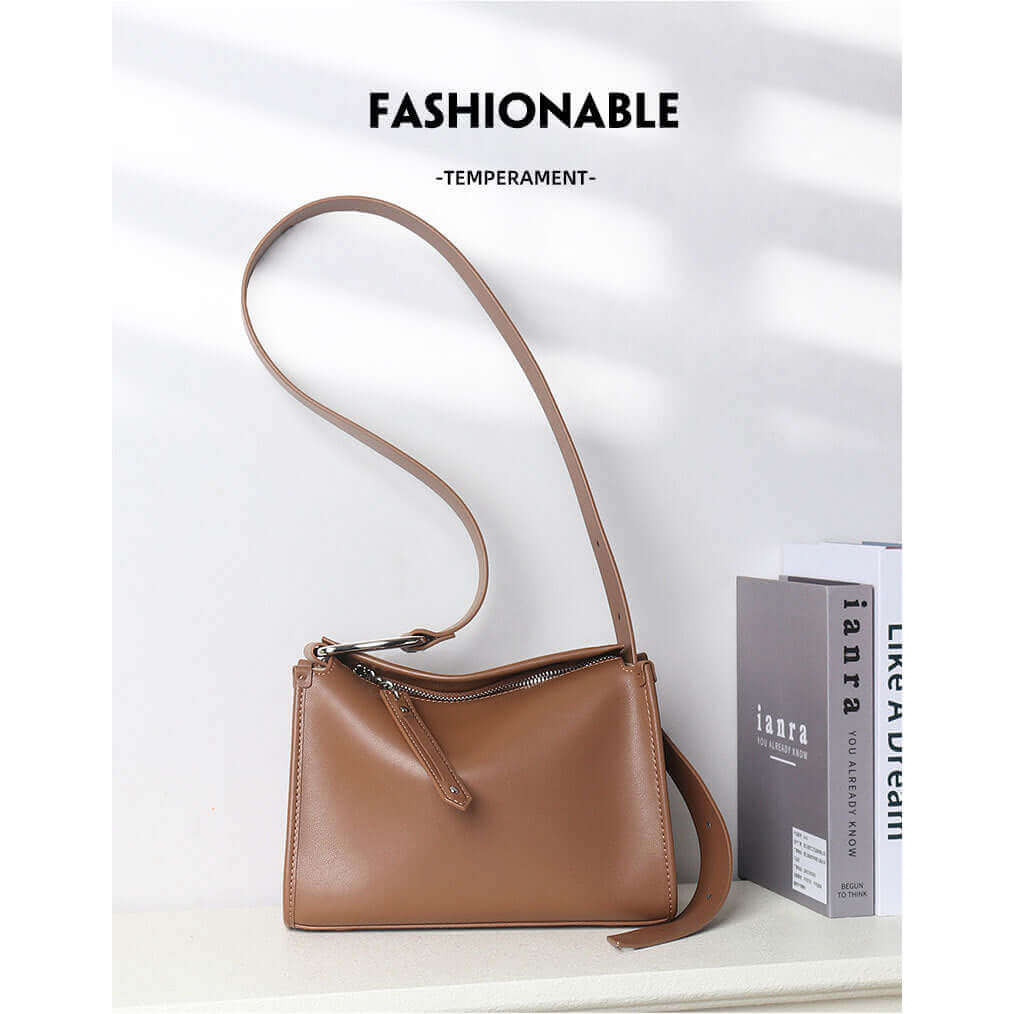 Leather shoulder bag with secure zipper pocket for essentials.