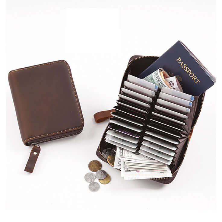 Open wallet filled with cards, cash, and passport showing large capacity.
