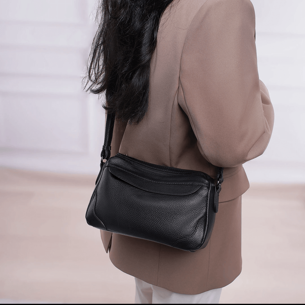Model showing crossbody fit of small leather bag
