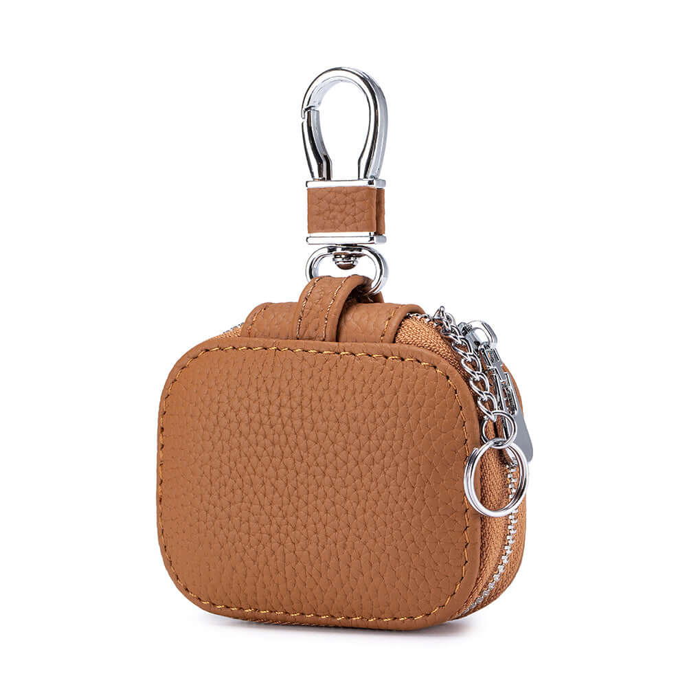 Brown leather earbud case with zip and metal keychain detail.