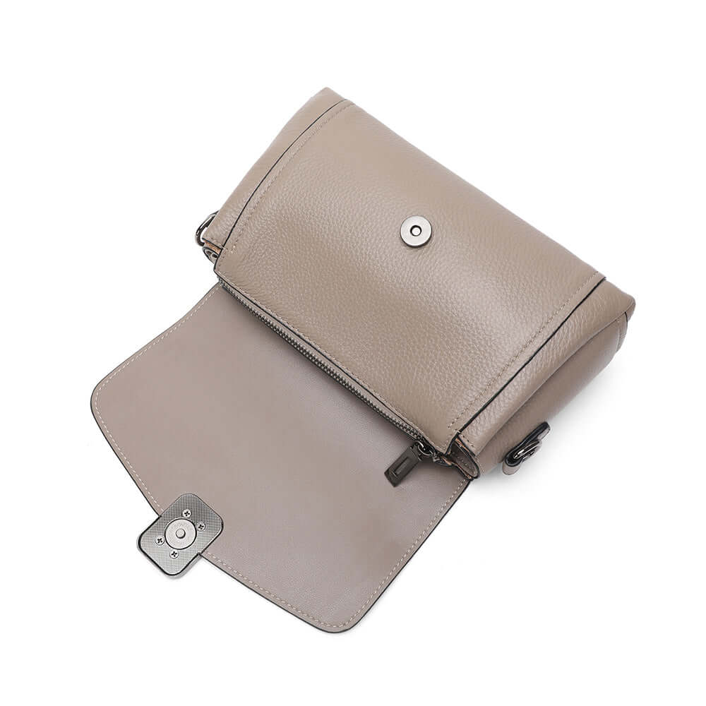 Orner stitching and leather grain detail of flap shoulder bag