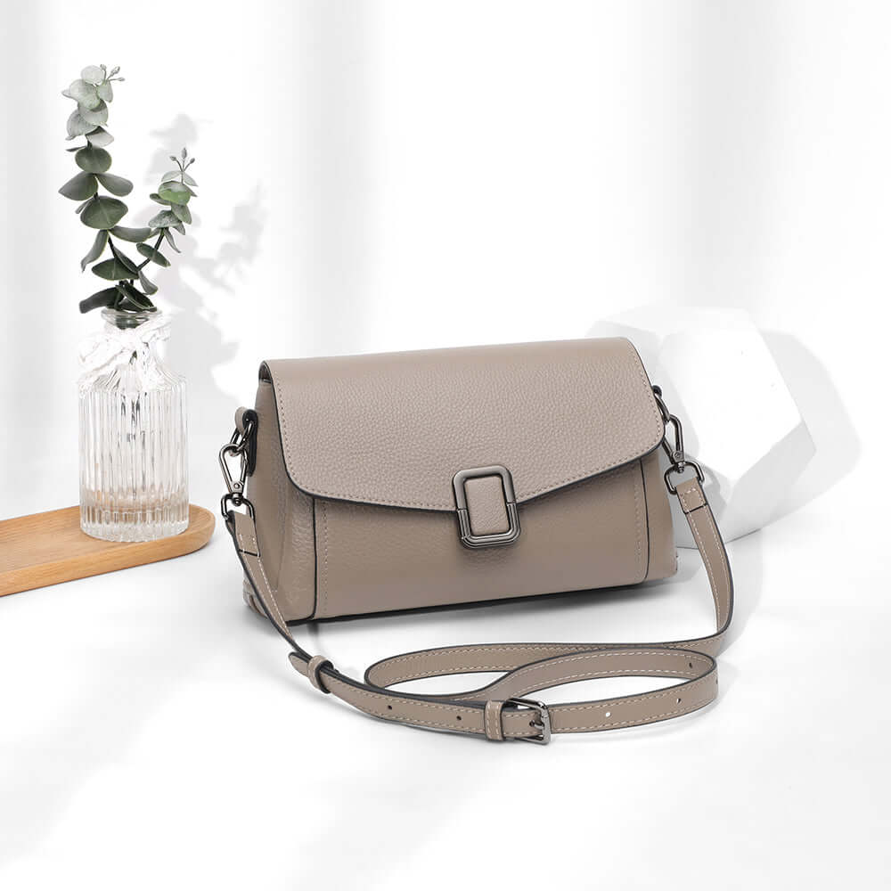 Front view of taupe leather flap shoulder bag for women