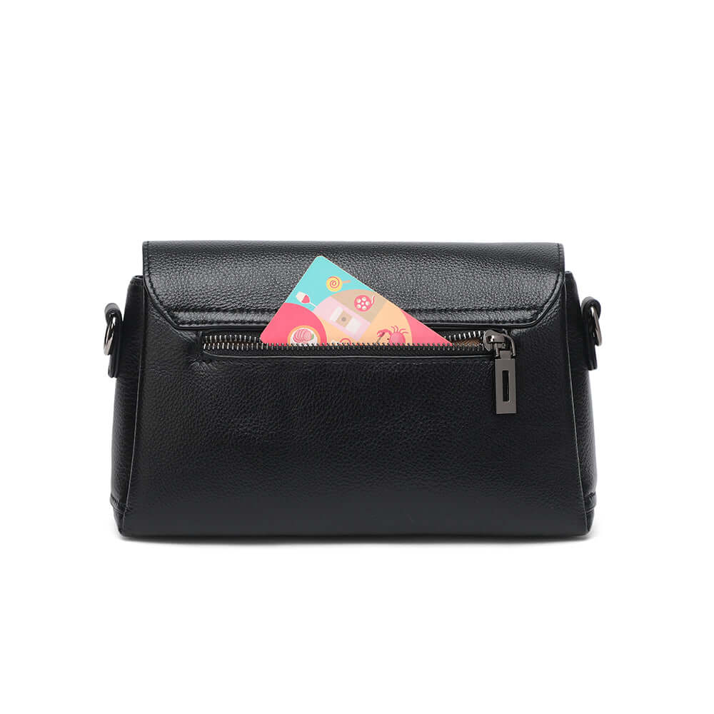 Black handbag with a colorful card sticking out of the zipper