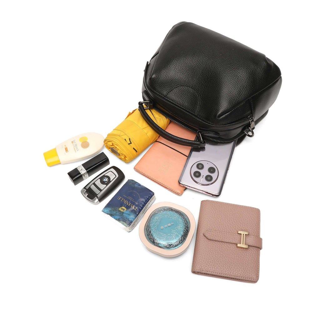 Black leather handbag showing storage capacity