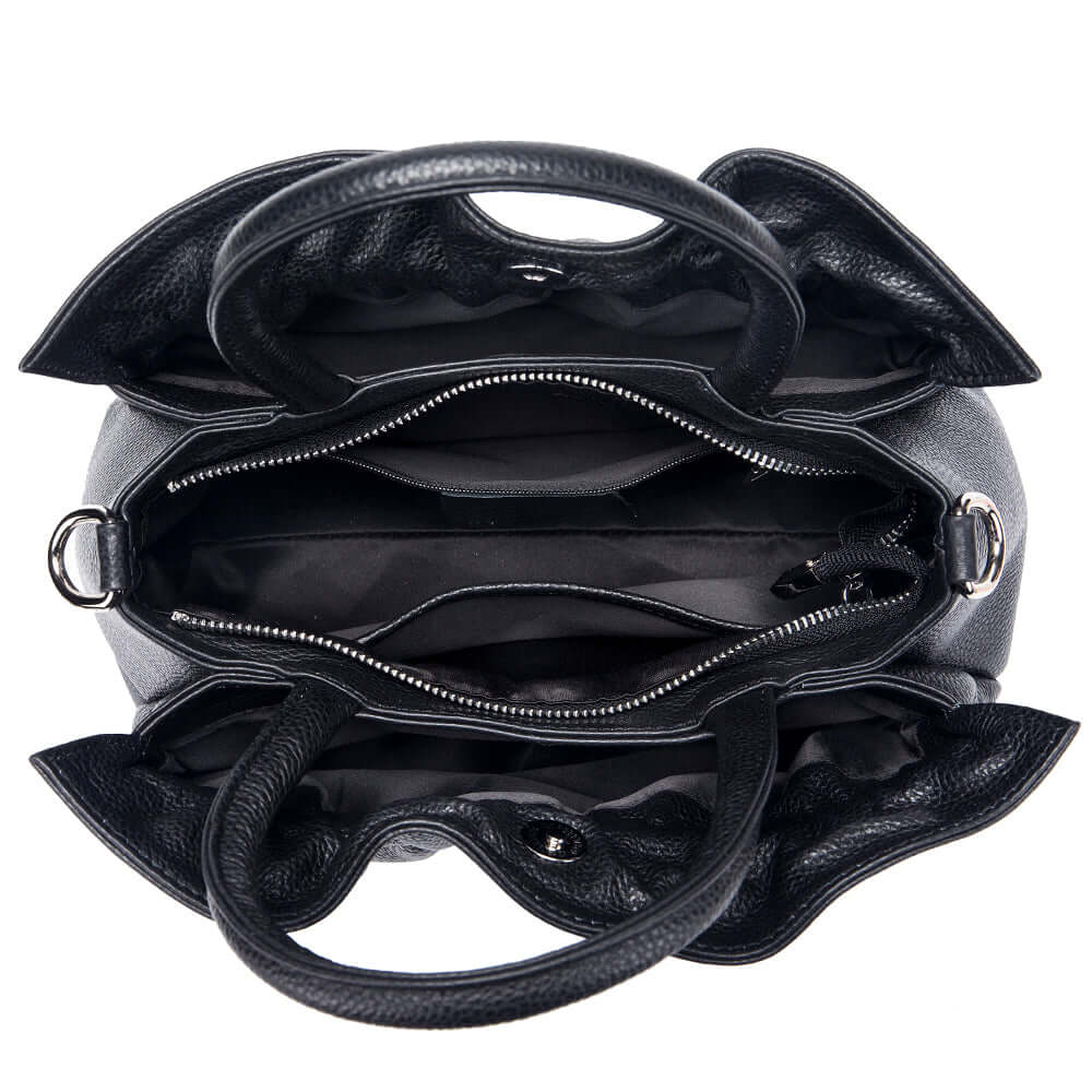 Interior compartments of black leather handbag