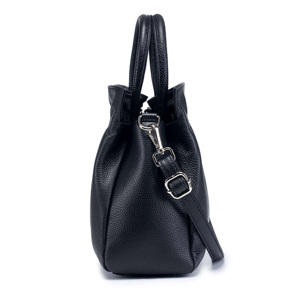 Black leather handbag side view showing soft pleats