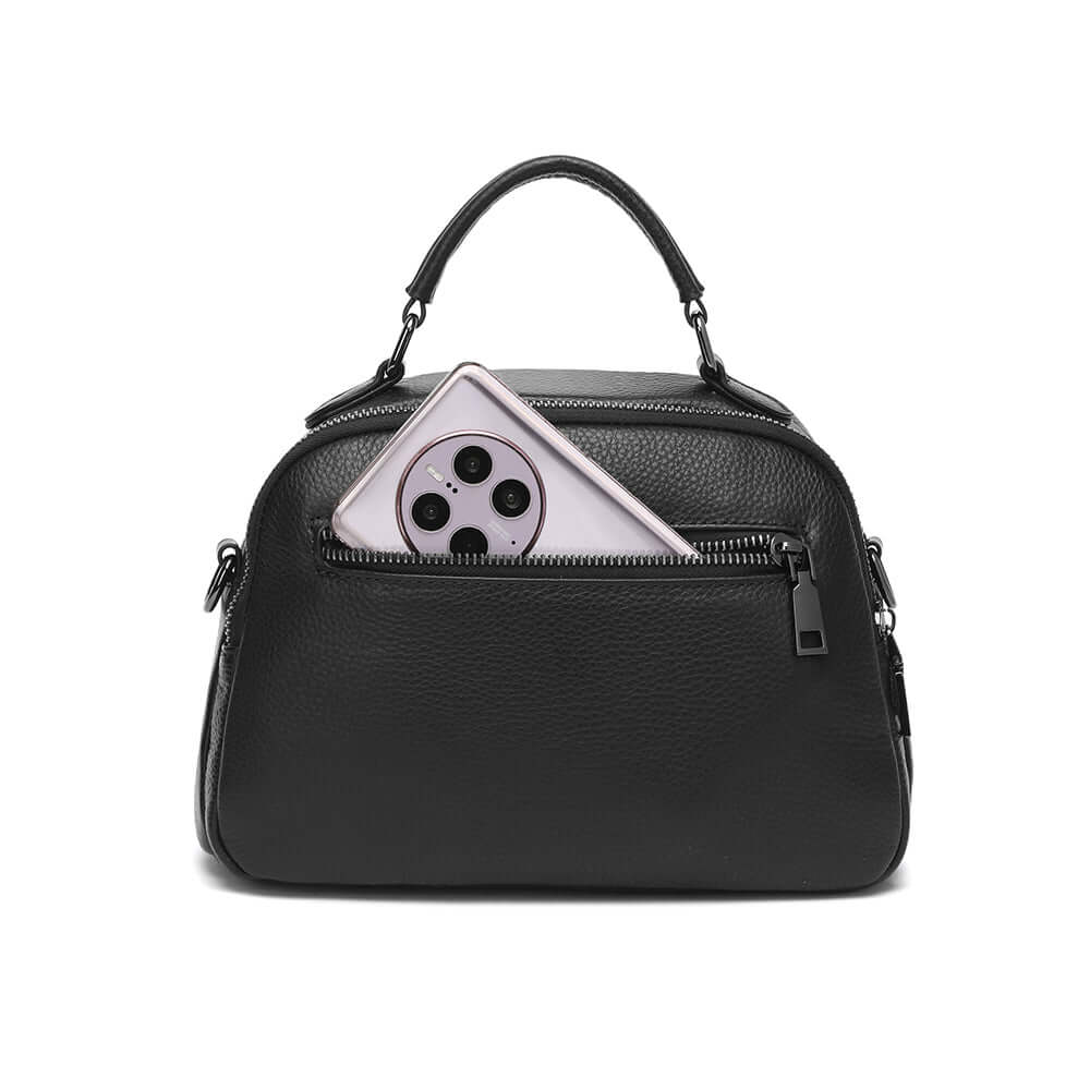 Black leather handbag zipper detail close-up