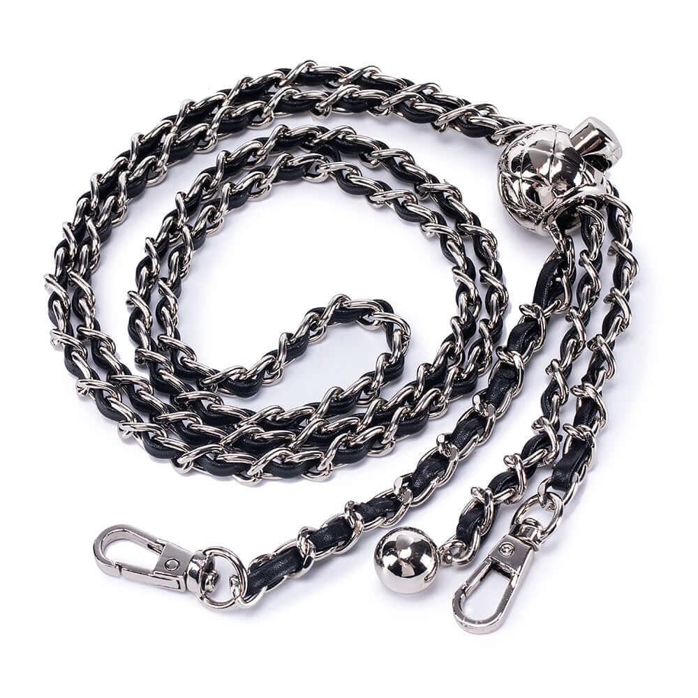 Close-up of chain strap detail on leather handbag
