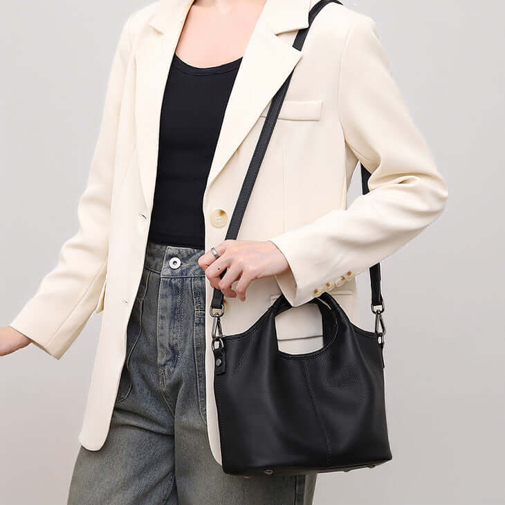 Adjustable strap black leather crossbody handbag