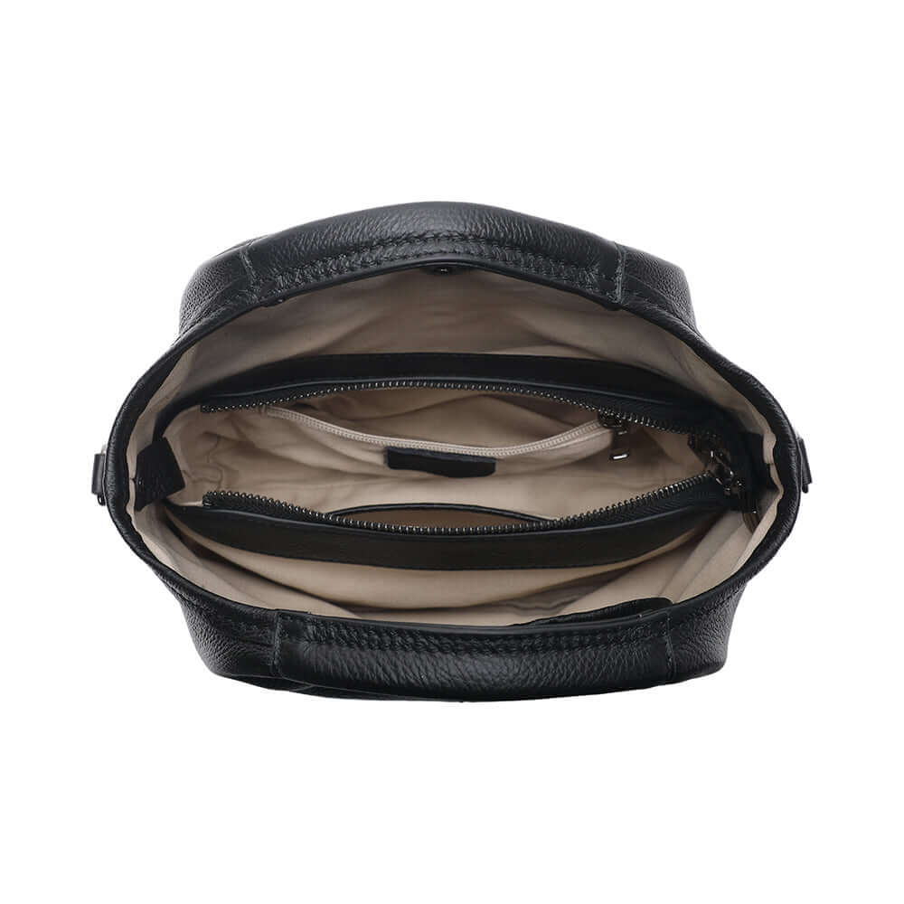 Inside opening view of women’s leather handbag