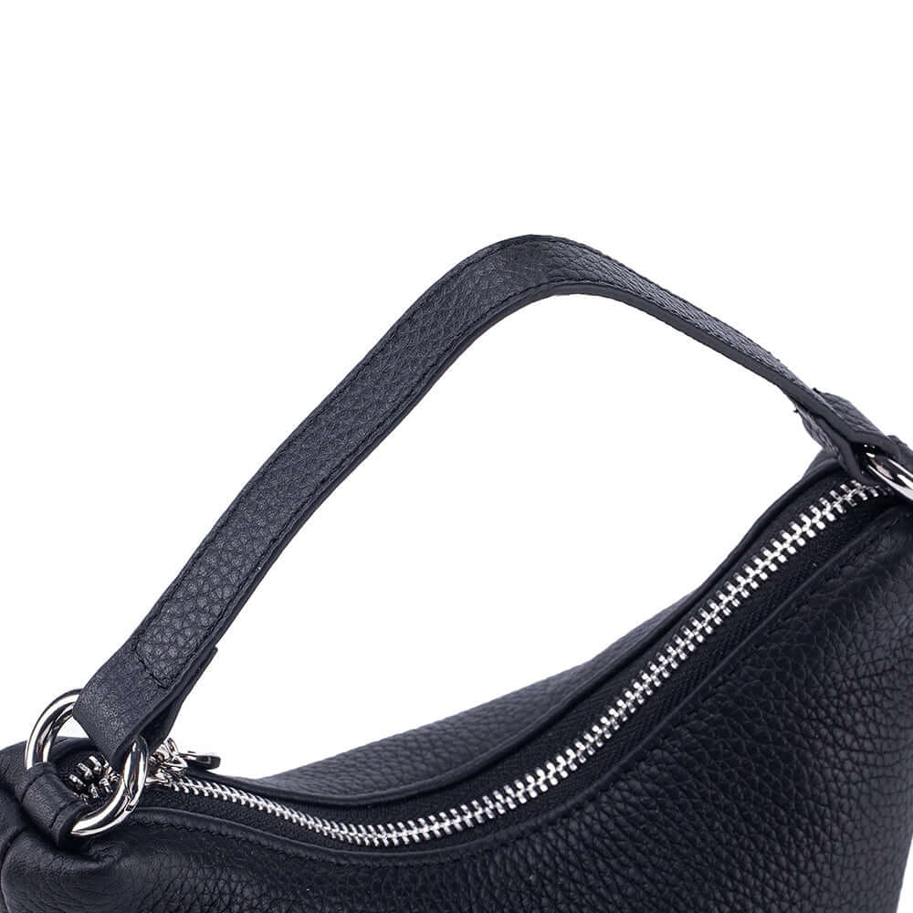 Black leather mini handbag close-up detail