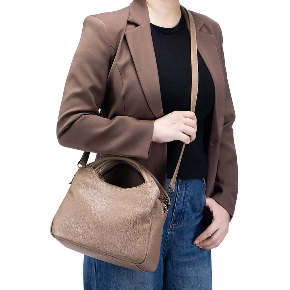 model wearing apricot leather shoulder bag crossbody