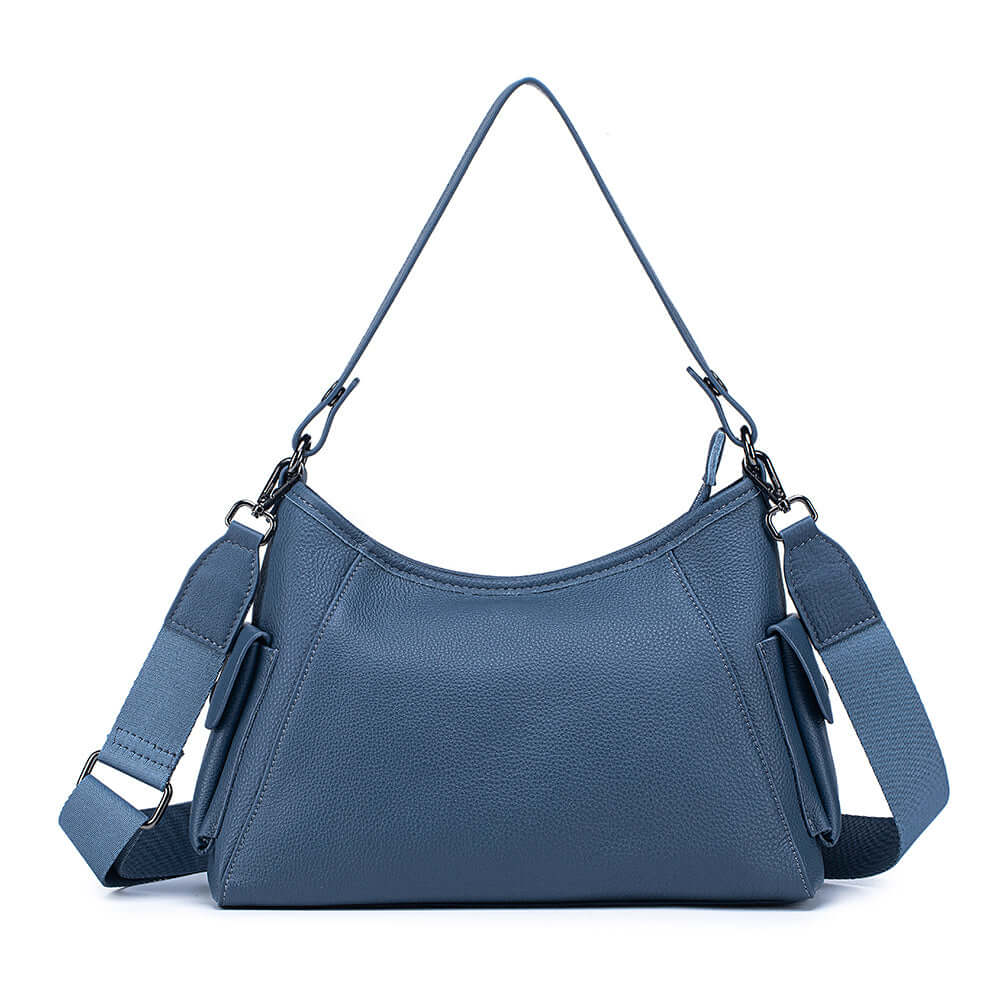 Front view of blue leather shoulder bag with detachable strap.