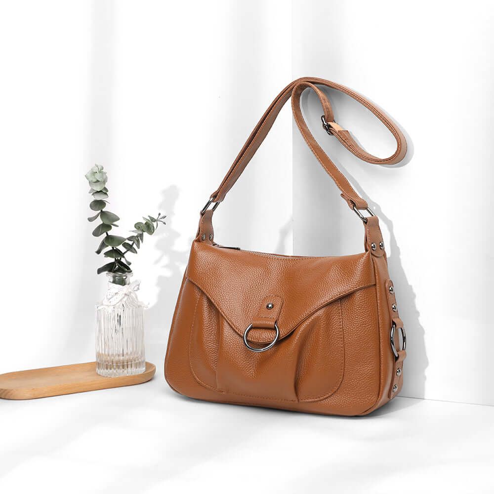 Side angle of the brown leather shoulder bag