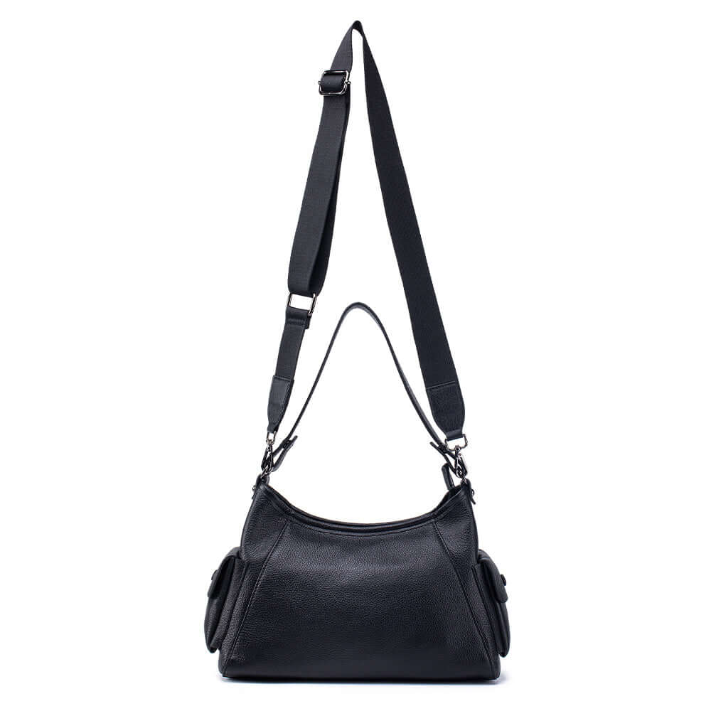 Adjustable crossbody strap with metal hooks on leather bag.