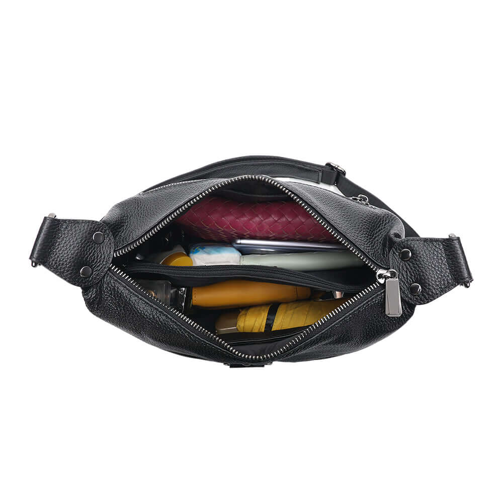 Shoulder bag shown with daily essentials inside