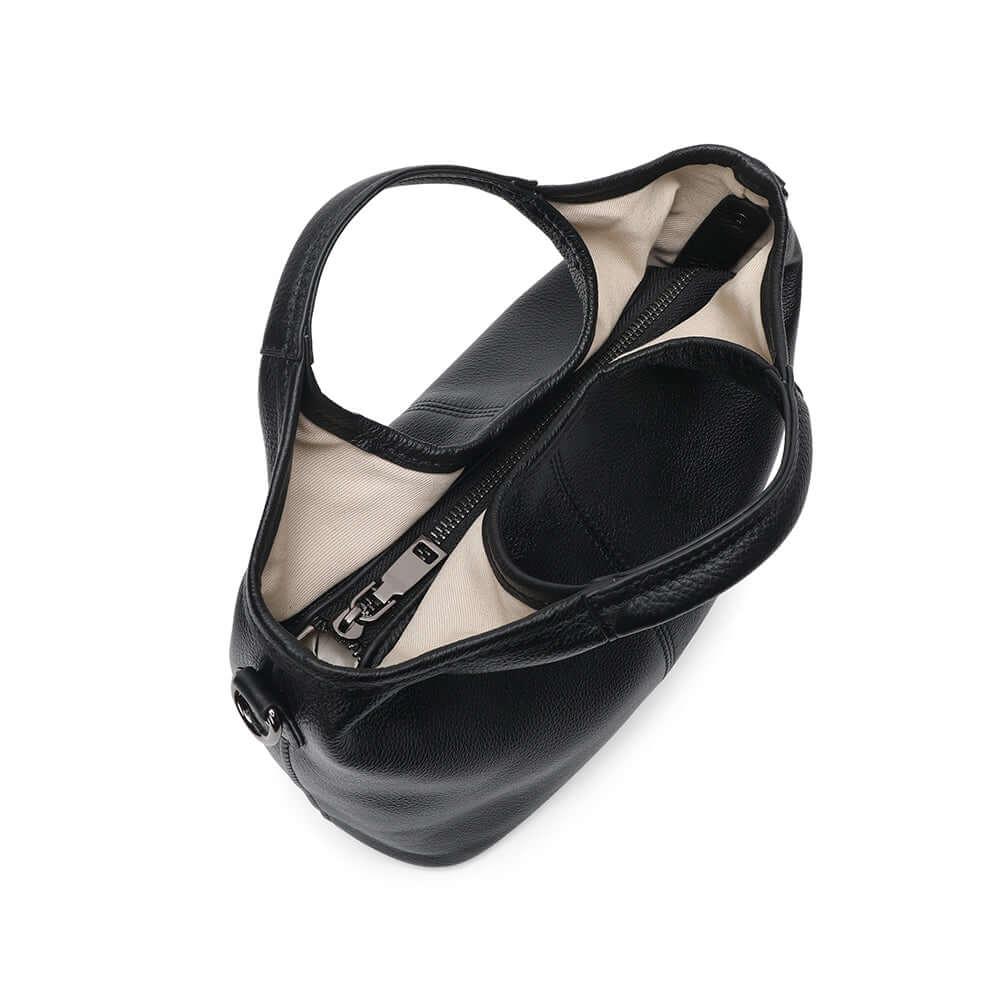 Close-up detail of leather handbag handles