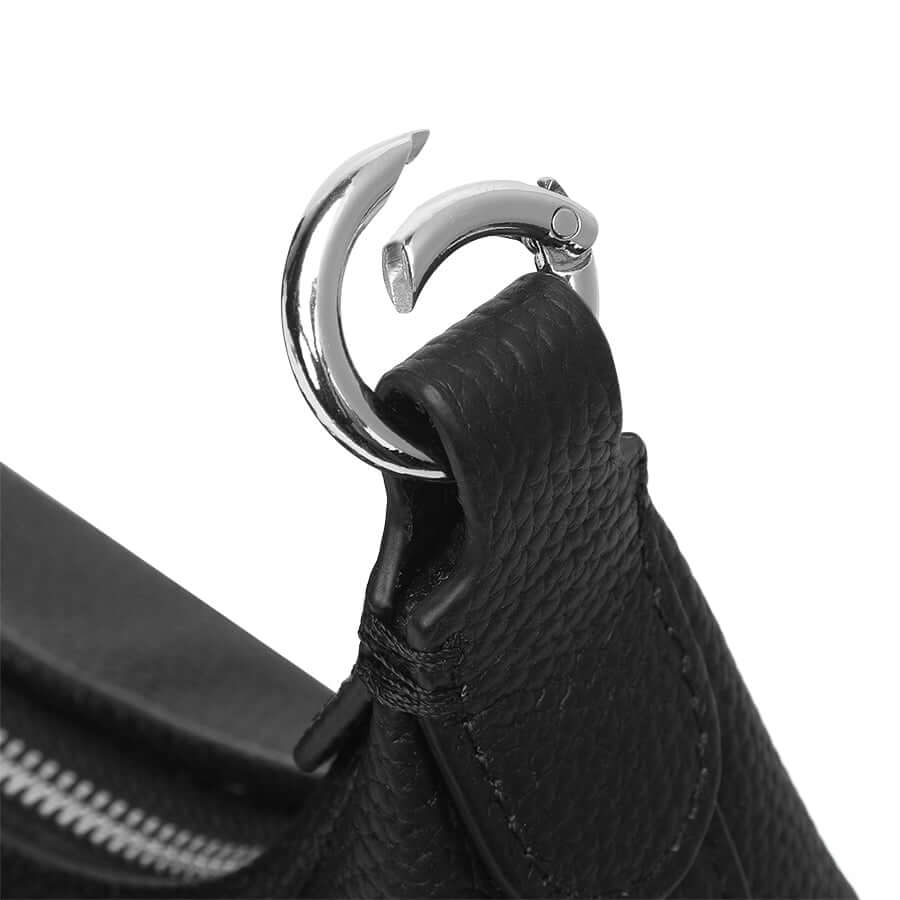 Metal hardware detail on leather shoulder bag