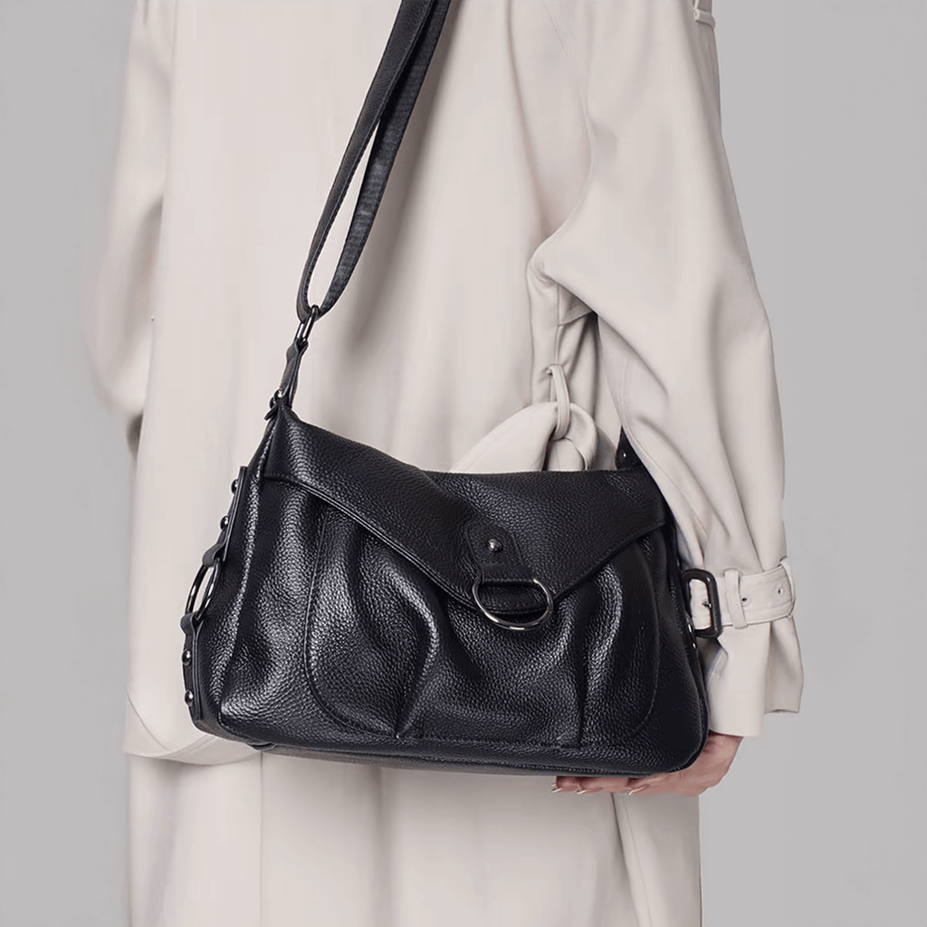 Model wearing the leather shoulder bag on shoulder