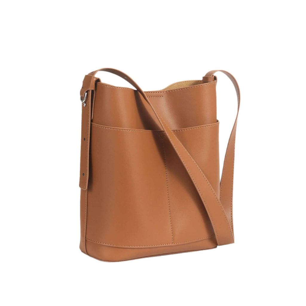 Front view of women's leather shoulder bucket bag in brown.