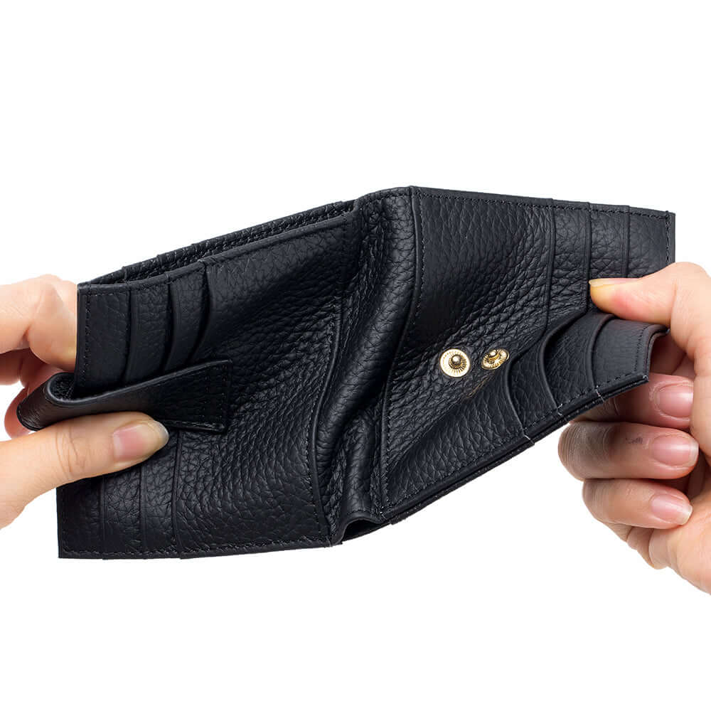Hand holding black slim leather card holder wallet