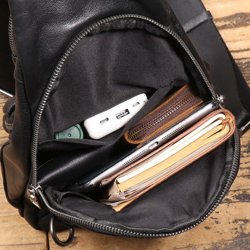 main compartment of black leather chest sling bag