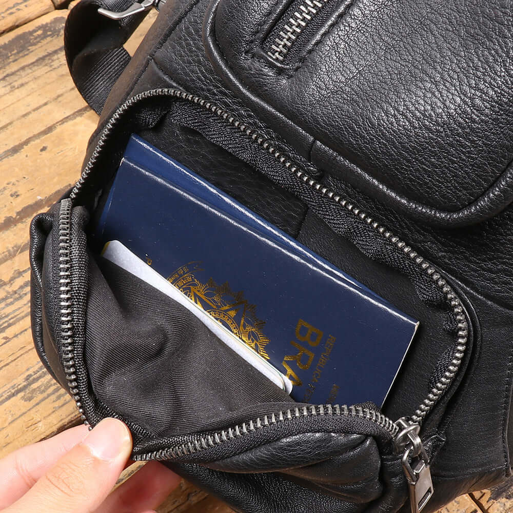 front pocket detail of black leather chest sling bag