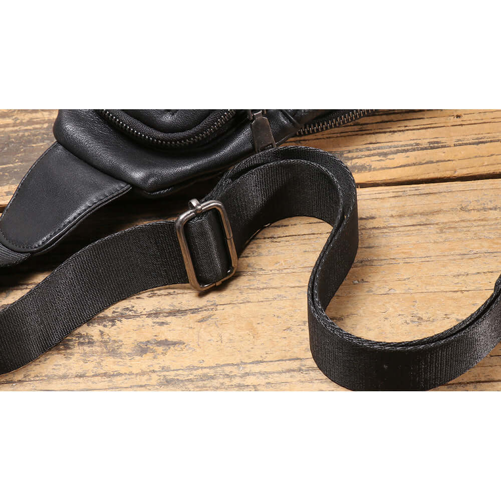 adjustable shoulder strap detail of black leather bag