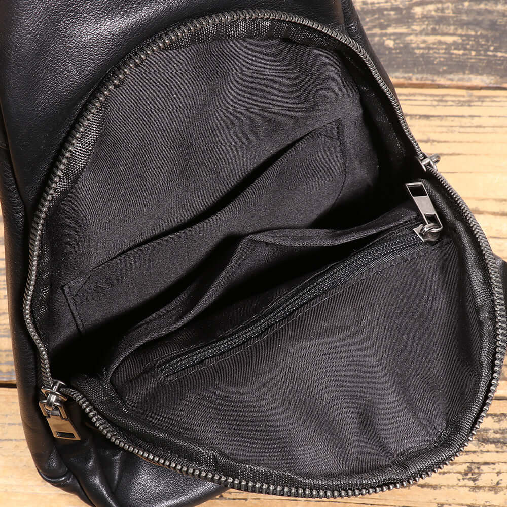 top section and opening of black leather sling bag