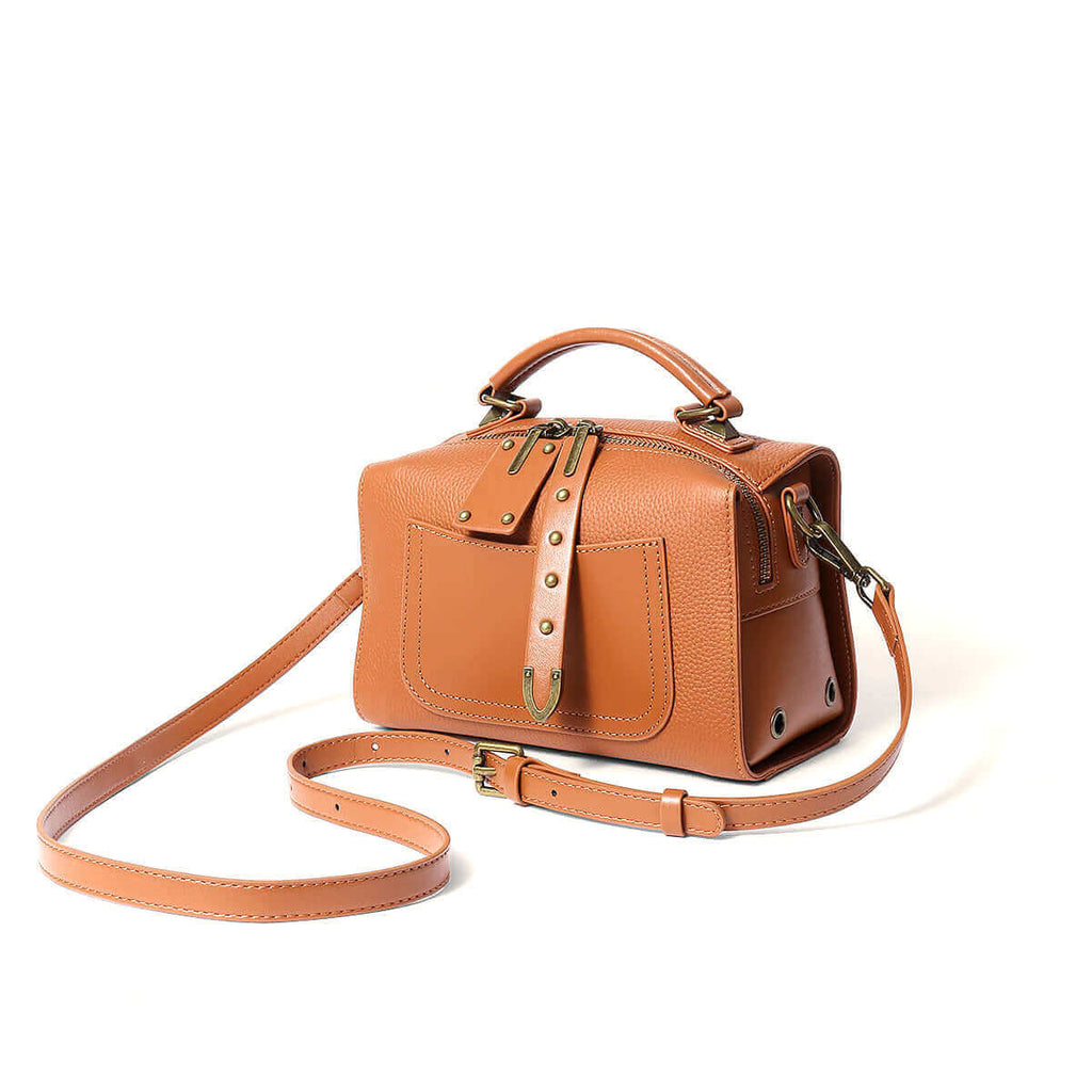 Women's leather small box bag front view in brown.