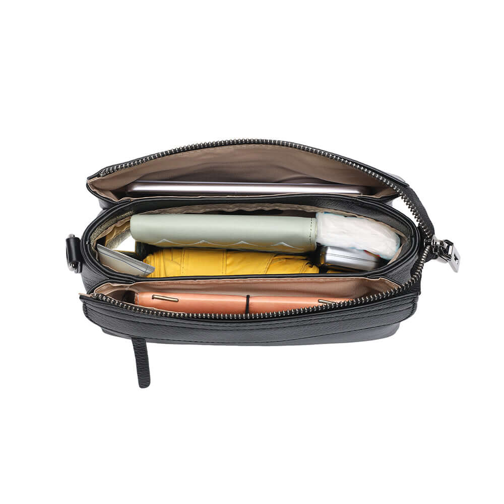 Open top view of women’s compact black leather crossbody purse.
