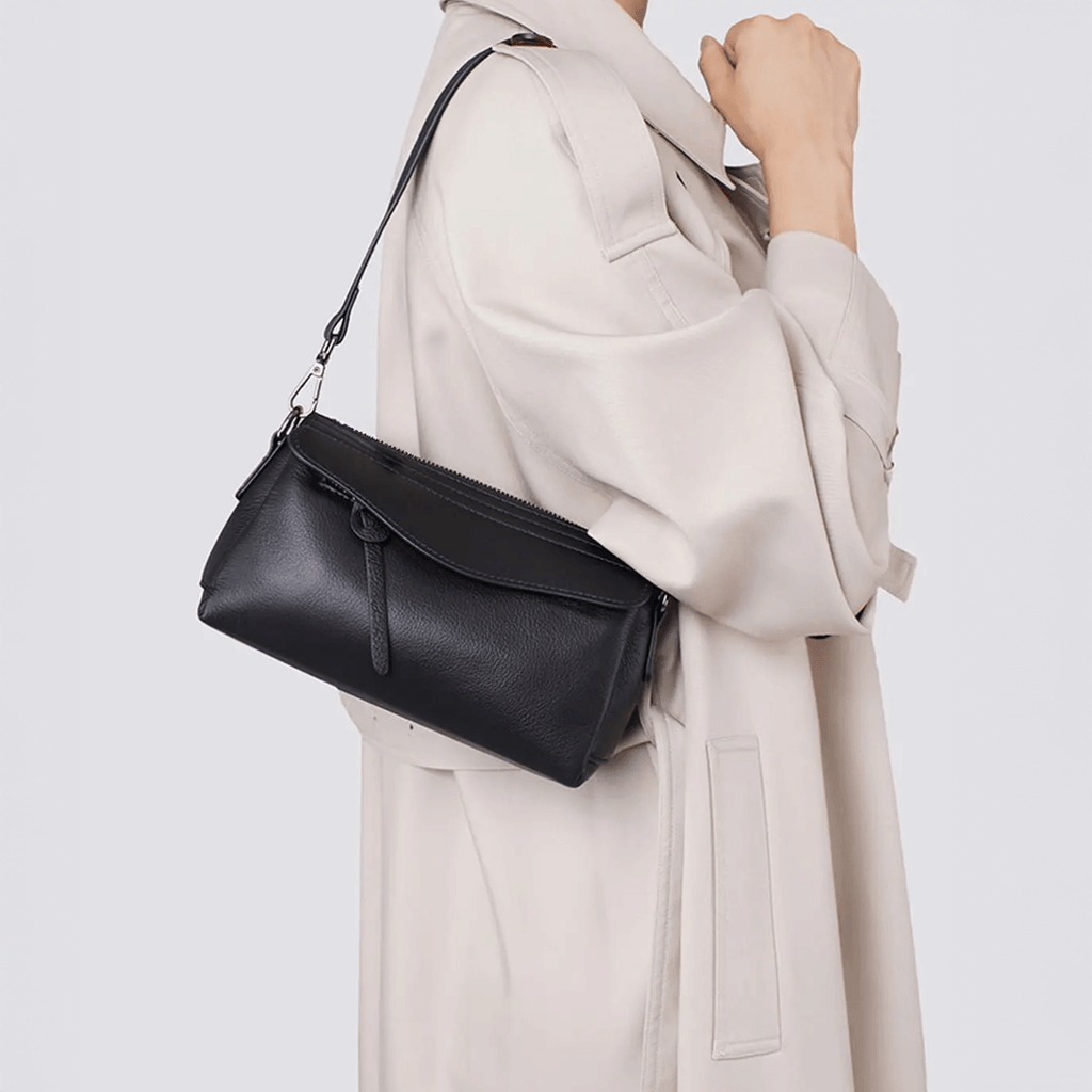 Outfit matching display with women’s small black leather purse