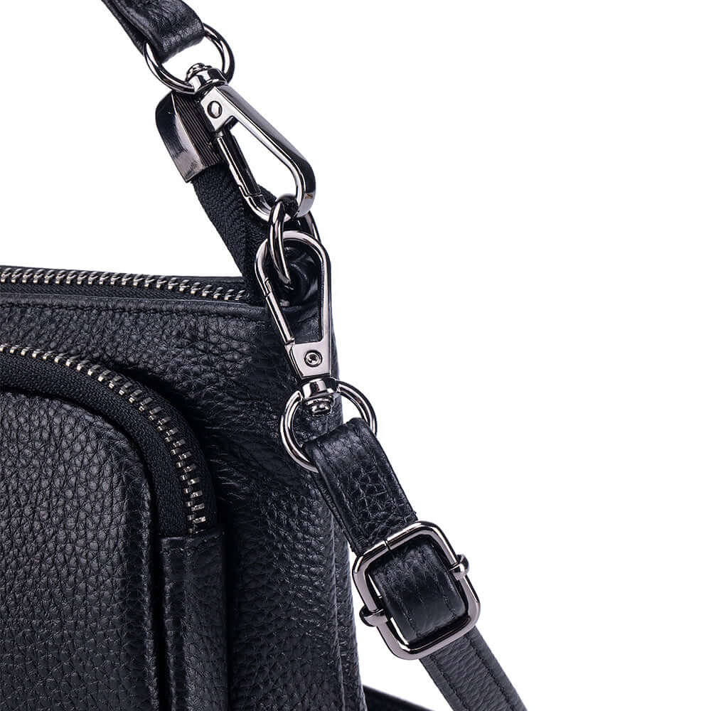 Close-up stitching on leather small crossbody bag