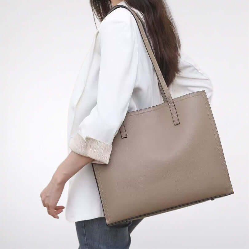 Model wearing leather tote bag