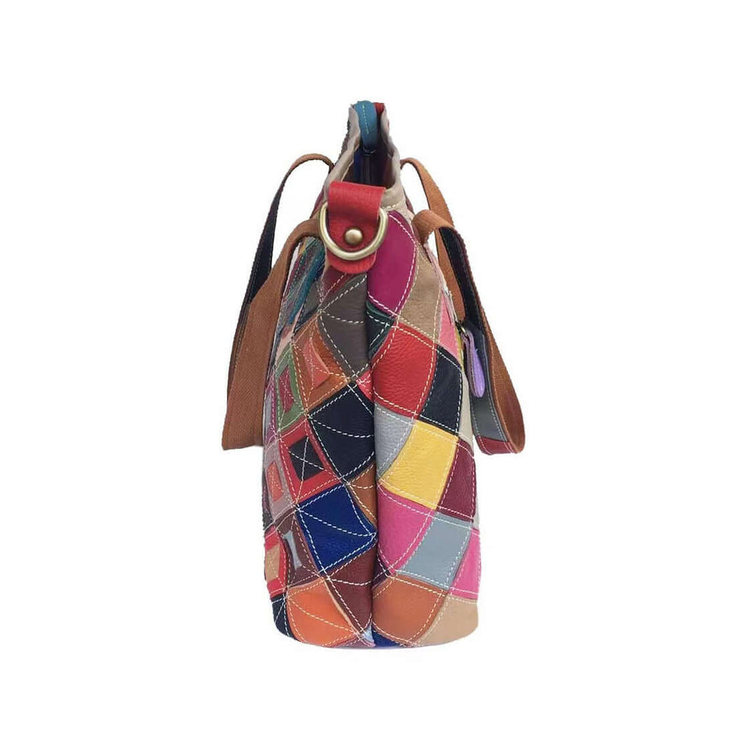 Side view of a spacious leather tote bag in a colorful patchwork design