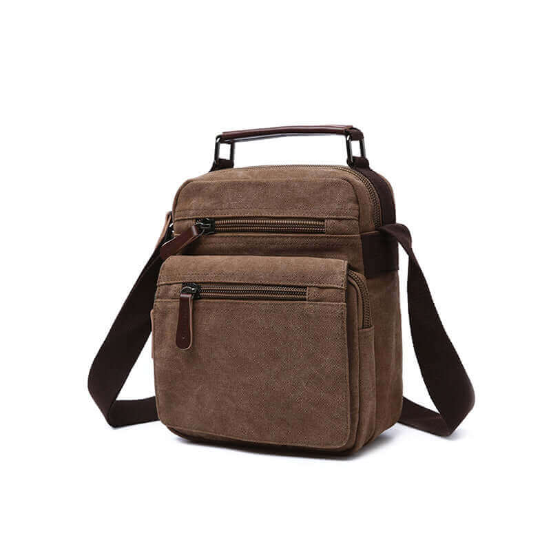 Men's coffee canvas crossbody bag with leather accents and multiple zippered compartments.