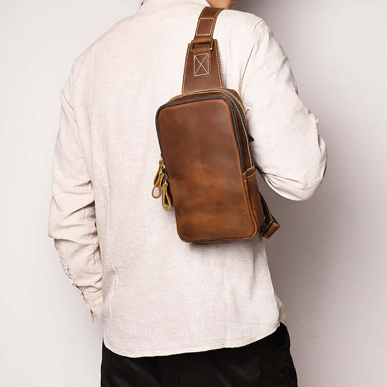 Men’s leather sling chest pack with durable zippers